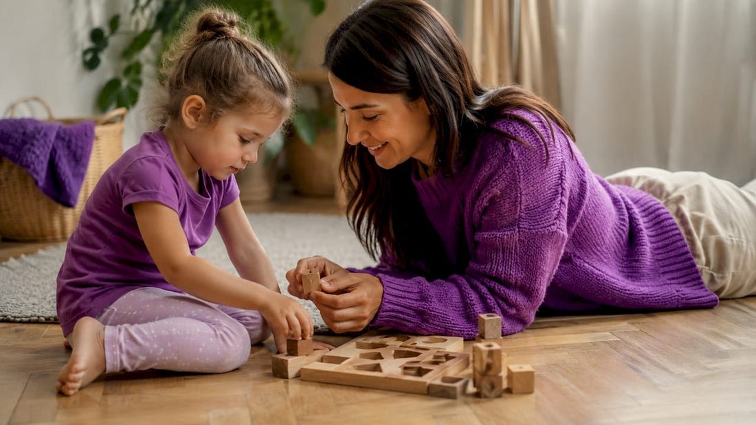Child tracing letters on worksheet at table